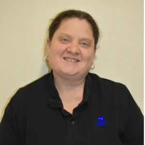 Headshot of Julie Webber, Co owner of Friendly Fish Aquatics, smiling warmly against a plain background."