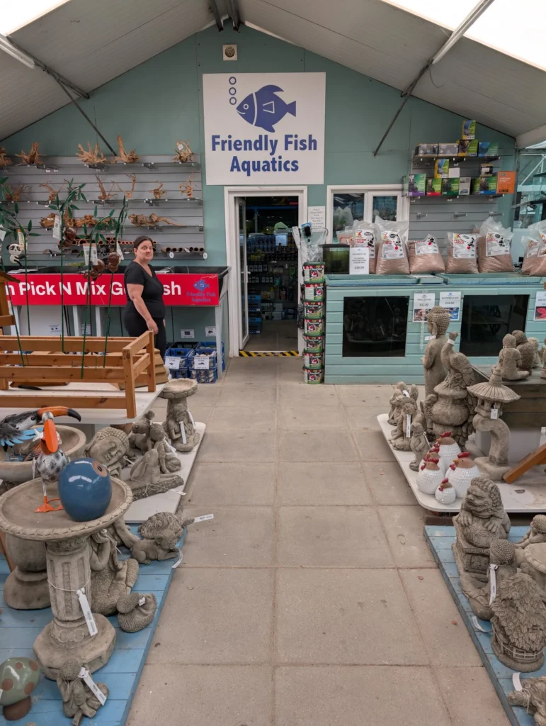 Front of Friendly Fish Aquatics shop in Harlow, Essex, showing the blue signage and entrance at Bonnie’s Oak Garden Centre.